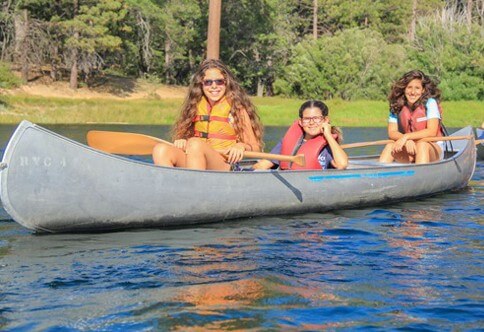 Campers canoeing on Jenks Lake